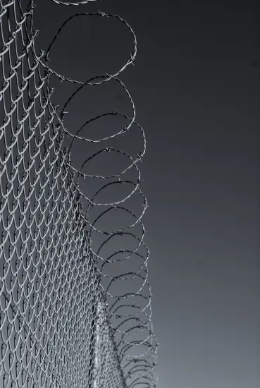 Chain-link fence with barbed wire from a UAE fencing supplier