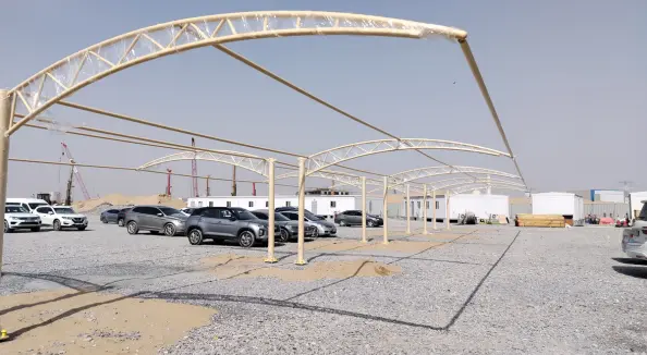 Steel car parking shades installed by a dubai fencing supplier